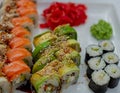 Rainbow Sushi Roll with salmon, eel, tuna, avocado, royal prawn, cream cheese Philadelphia, caviar tobica, chuka Royalty Free Stock Photo