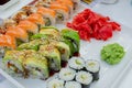 Rainbow Sushi Roll with salmon, eel, tuna, avocado, royal prawn, cream cheese Philadelphia, caviar tobica, chuka Royalty Free Stock Photo