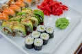 Rainbow Sushi Roll with salmon, eel, tuna, avocado, royal prawn, cream cheese Philadelphia, caviar tobica, chuka Royalty Free Stock Photo