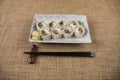 Rainbow Sushi Roll with salmon, eel, tuna, avocado, royal prawn, cream cheese Philadelphia, caviar tobica, chuka. Sushi menu. Royalty Free Stock Photo