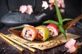 Rainbow Sushi Roll with salmon, eel, tuna, avocado, royal prawn, cream cheese Philadelphia, caviar tobica, chuka. Sushi menu. Royalty Free Stock Photo