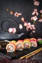 Rainbow Sushi Roll with salmon, eel, tuna, avocado, royal prawn, cream cheese Philadelphia, caviar tobica, chuka. Sushi menu. Royalty Free Stock Photo