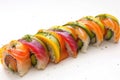 Rainbow sushi rolls with salmon and avocado on white background. Japanese food. AI Generated Royalty Free Stock Photo