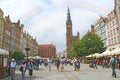 Rainbow in tourist center of Gdansk. Rainbow in city. European tourists walking