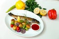 Rainbow trout with grilled vegetables and citrus sauce Royalty Free Stock Photo