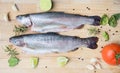 Rainbow trouts on wooden cutting board Royalty Free Stock Photo