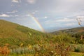 a rainbow between two mountains Royalty Free Stock Photo