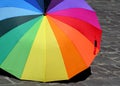 Rainbow umbrella on the pavement