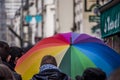 Rainbow umbrella on the streets of Paris France