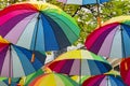 Rainbow Umbrellas hanging overhead in 4th Arrondissement, Le Marais, Paris, France