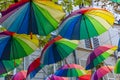 Rainbow Umbrellas hanging overhead in 4th Arrondissement, Le Marais, Paris, France