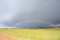 The rainbow under the dark clouds in Tibet