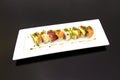 Rainbow Uramaki with Ripe Avocado, Marinated Salmon, Red Tuna, Chives