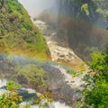 Rainbow at the Victoria Falls on Zambezi River, border of Zambia and Zimbabwe Royalty Free Stock Photo