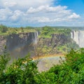 Rainbow at the Victoria Falls on Zambezi River, border of Zambia and Zimbabwe Royalty Free Stock Photo