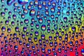 Rainbow water droplets macro background Royalty Free Stock Photo