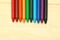 Rainbow wax crayons on wood Royalty Free Stock Photo