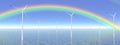 Rainbow and wind turbines Royalty Free Stock Photo