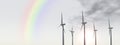 Rainbow and wind turbines Royalty Free Stock Photo