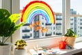 Rainbow on window during quarantine at home. Royalty Free Stock Photo
