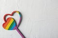 Rainbow wooden hearts on light background. LGBT concept