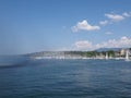 Rainbow and yachts at swiss Leman Lake landscape at european Geneva city promenade in Switzerland Royalty Free Stock Photo