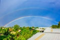 Rainbows on blue sky over the roof top
