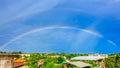 Rainbows on blue sky over the roof top