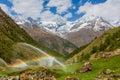 Rainbows in irrigation water spouts in Alps mountain Royalty Free Stock Photo