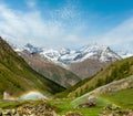 Rainbows in irrigation water spouts in Alps mountain Royalty Free Stock Photo