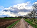 Rainclouds over the fields with Sun