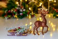 Raindeer toy with sled on Christmas background. Royalty Free Stock Photo