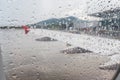 Raindrops on airplane window during take off at the airport