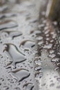 Raindrops on the car. Car element with raindrops close-up. Car rear glass with rain drops and frameless wiper blade closeup. Big Royalty Free Stock Photo