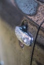 Raindrops on the car. Car element with raindrops close-up. Doors and door handle of a black car in raindrops. Big raindrops on the Royalty Free Stock Photo