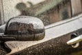 Raindrops on the car. Car element with raindrops close-up. Doors and door handle and glass of a black car in raindrops. Big Royalty Free Stock Photo