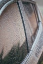 Raindrops on the car. Car element with raindrops close-up. Doors and door handle and glass of a black car in raindrops. Big Royalty Free Stock Photo