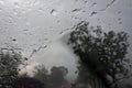 Raindrops on the car glass while driving through heavy rain and storm Royalty Free Stock Photo