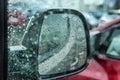 Raindrops on the car side view mirror. Close-up Royalty Free Stock Photo