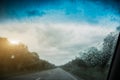 Raindrops on the car windscreen. Driving on the road. Bad grey weather Royalty Free Stock Photo