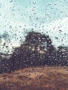 Raindrops on the cars glass window. Raindrops on the transparent window, on the glass. Weather, rain, texture. Blurred background