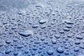 Raindrops on a blue car body with Hydrophobic Effect