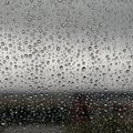 Raindrops cover a glass surface, creating a textured pattern. The Royalty Free Stock Photo