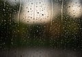 Raindrops create intricate patterns on a window, blurring the view Royalty Free Stock Photo