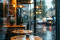 Raindrops create patterns on the cafÃÆÃÂ© window while soft indoor lighting casts a Royalty Free Stock Photo