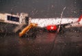 Raindrops falling on glass at the airport