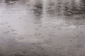 Raindrops falling on lake