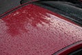 Water drops on roof of red car Royalty Free Stock Photo