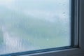 Raindrops flow down the window close-up indoor Royalty Free Stock Photo