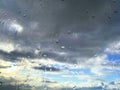 Raindrops on the glass against the blue sky Royalty Free Stock Photo